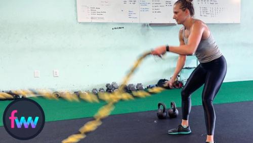 Kindal rocking out more fast battle ropes to get her heart rate up and burn out her arms.