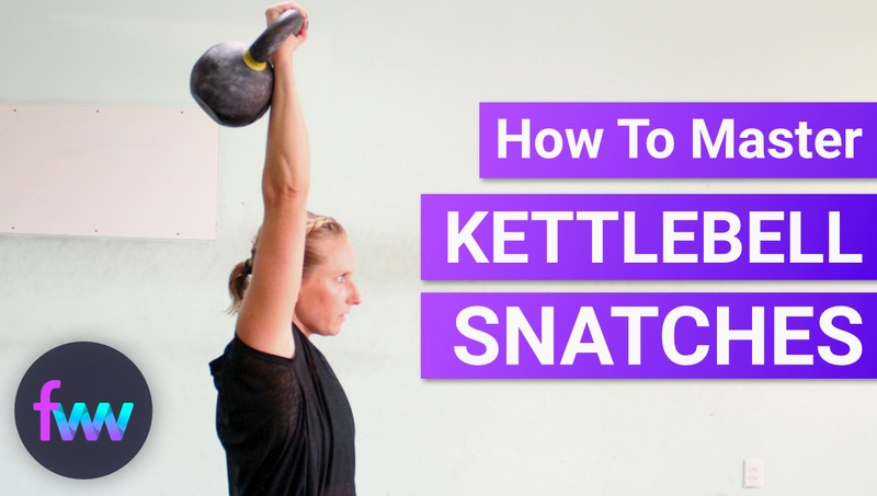 Kindal at the top of a kettlebell snatch