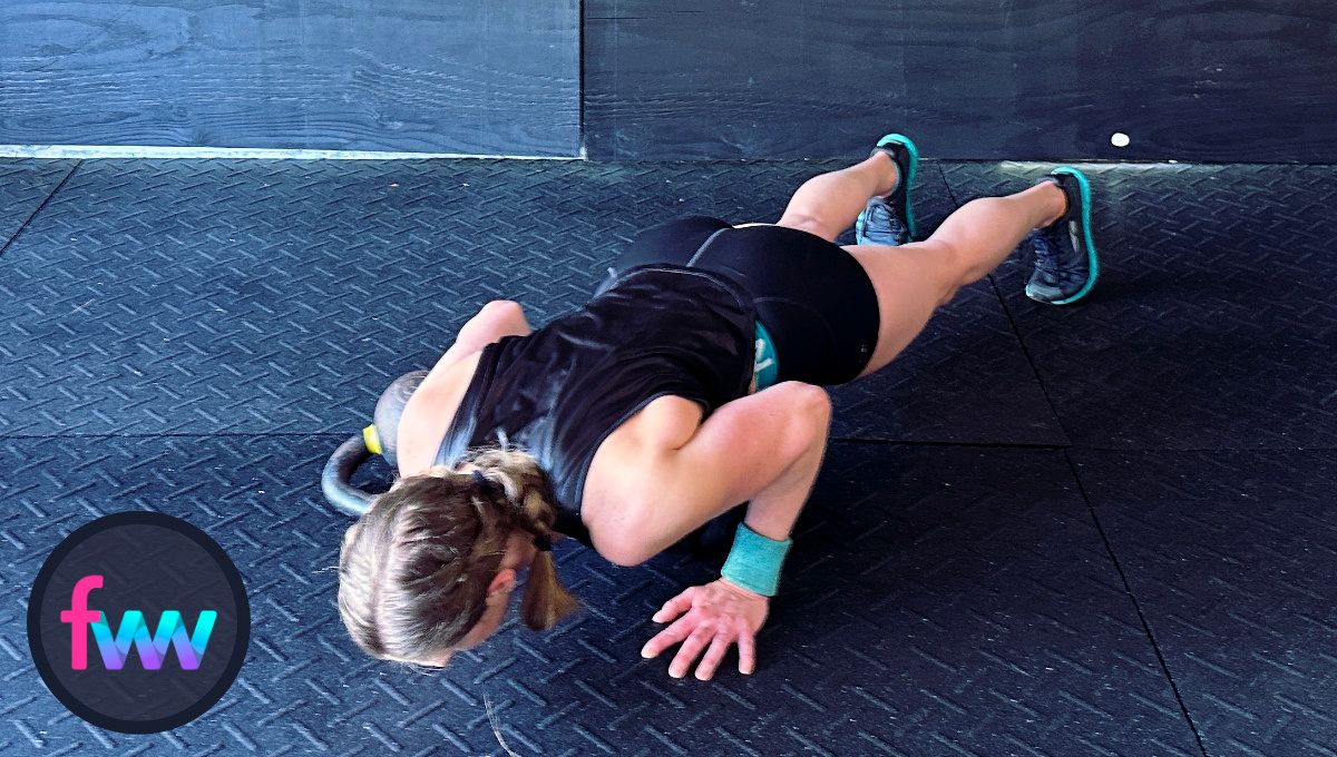Kindal dropping down into a great burpee pushup with her elbows straight back.