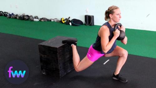 Kindal at the bottom of a kettlebell split squat