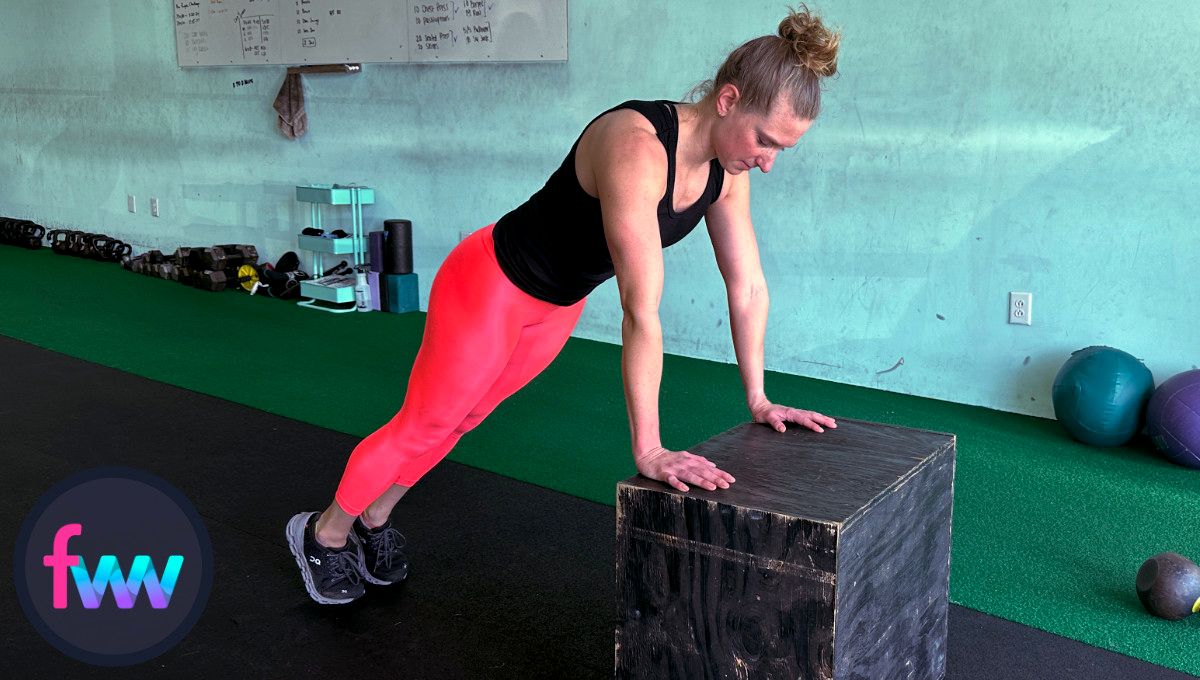 Kindal showing how to jump back during a box over burpee so she can continue a pushup with greater ease. One of the best modifications for burpees.