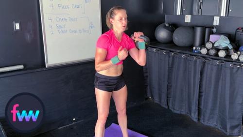 A quick pause in rack and Kindal is bracing her body to get the kettlebell pressed over her head.