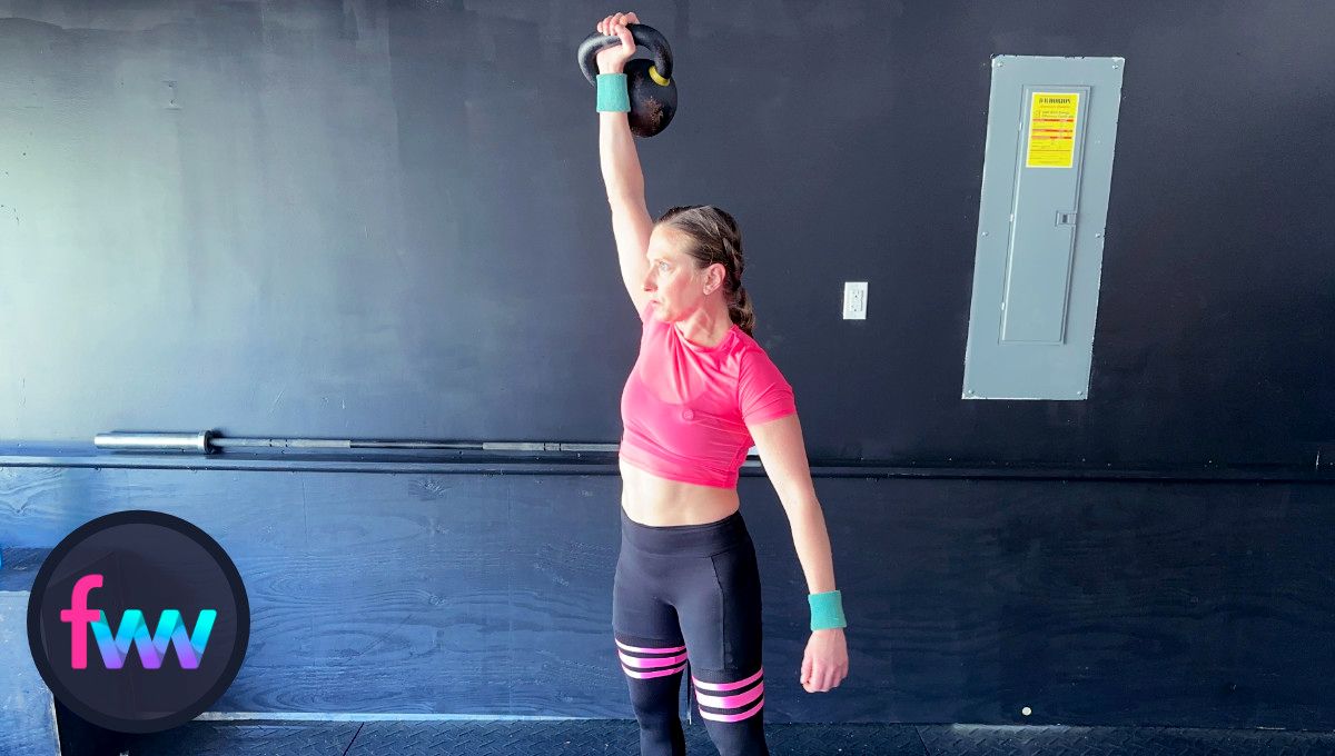 Kindal takes the momentum of her pull and gets the kettlebell fully pressed over her head already getting ready to go straight back down.
