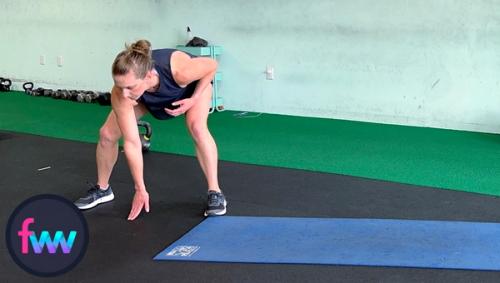 Kindal touching the ground and getting ready to shuffle across the yoga mat in an athletic stance.