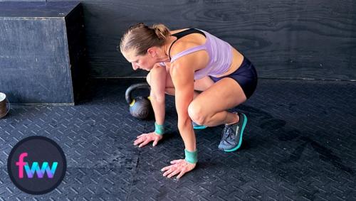 Kindal pushups back up and lets her hips sink a little because she transfers immediately into a jump back to the tuck position.