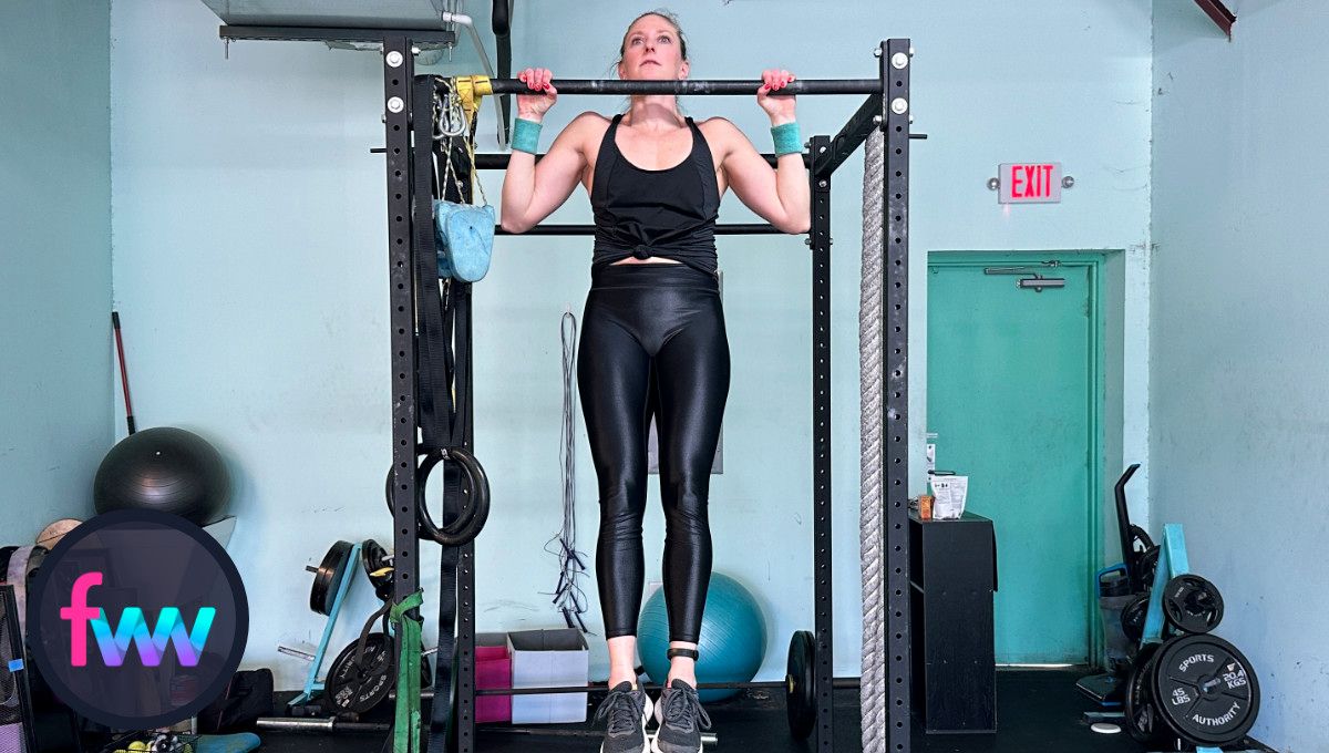 Kindal is above the bar during the pull up. It's a little hard to tell but she is higher than it looks as the picture was taken below bar level. Get your chest to the bar.