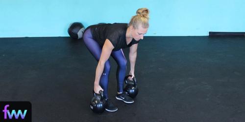 Kindal at the bottom of the double kettlebell deadlift