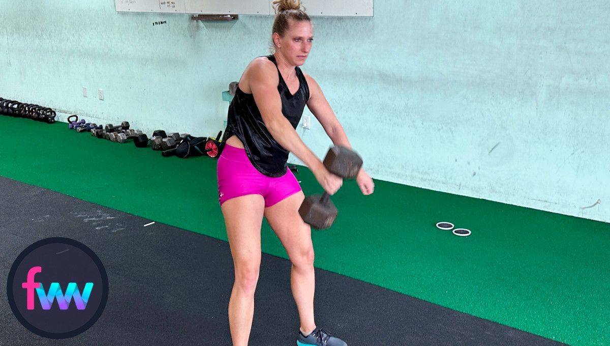 Kindal using her hips and pulling the dumbbell up as hard as possible.