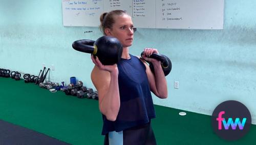 Kindal holding a kettlebell palmed and racked.