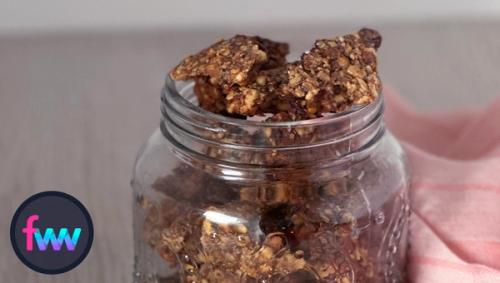 A jar full of big chunky Kettlebell Crunch granola.