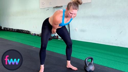 Kindal in the fully loaded kettlebell power position. She will need all of the power her hips can produce to get the kettlebell over her head. Notice she is in a good balance position.