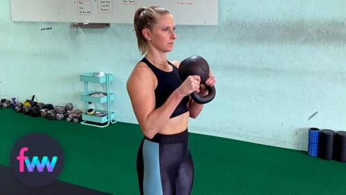 Kindal in the starting position of the kettlebell halo.