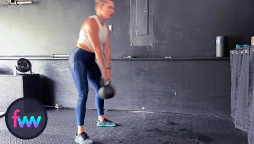 Kindal firing from her hips to get the kettlebell moving.