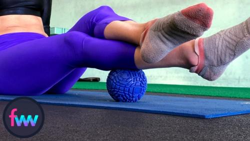 Kindal is showing how to use a trigger ball on the spots found with the foam roller. This smash will increase blood to the area while breaking up small knots of muscle fascia.