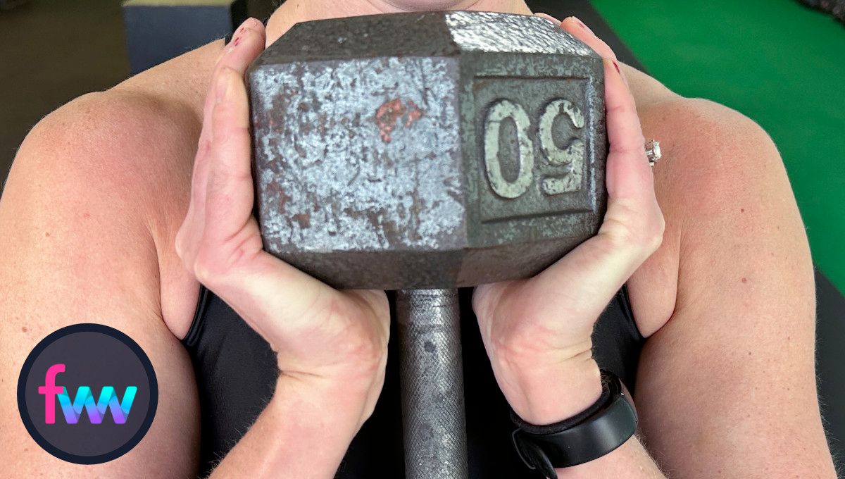 Kindal showing a close up of the dumbbell vertical grip.