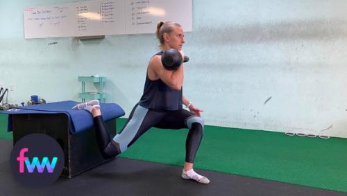 Kindal doing split squats with a racked kettlebell.