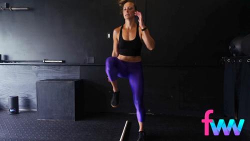 Kindal doing high knees over a bar and working on her agility to move laterally while still getting her knees up high and moving really fast.