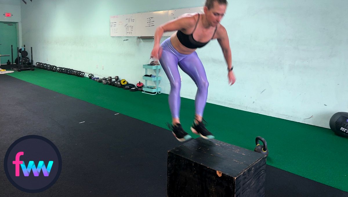 Kindal is getting ready to land on the box softly so she can jump off and into the next burpee.