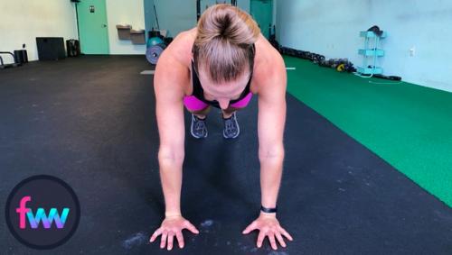 Kindal showing what a normal hand position looks like for pushups.