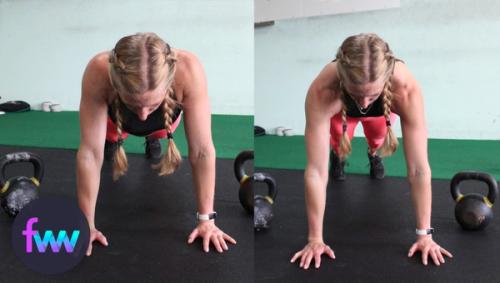 Kindal doing shoulder pulses in the top of a pushup plank.