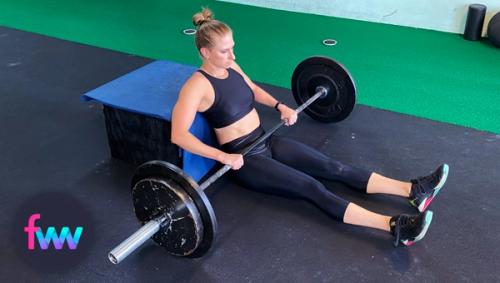 Kindal sliding under the barbell.