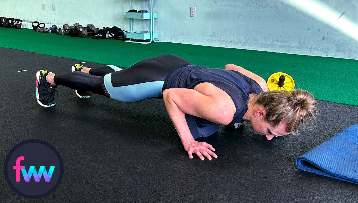Kindal jumps back and falls directly into the burpee pushup and she keeps her hand on the dumbbell this whole time.