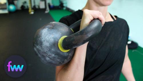 Kindal holding a racked kettlebell