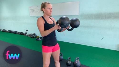 Kindal showing the top of the double kettlebell swings.