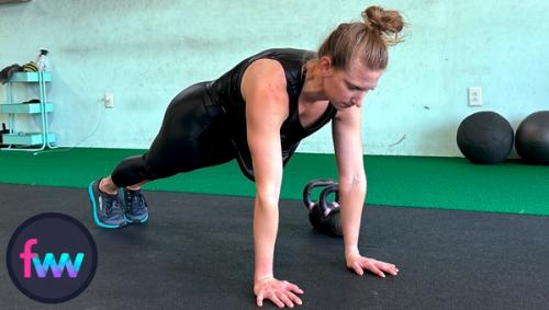 Kindal in the top of a pushup plank. This is the start of shoulder taps. Her body is tight and engaged so she can focus on keeping her hips quiet.