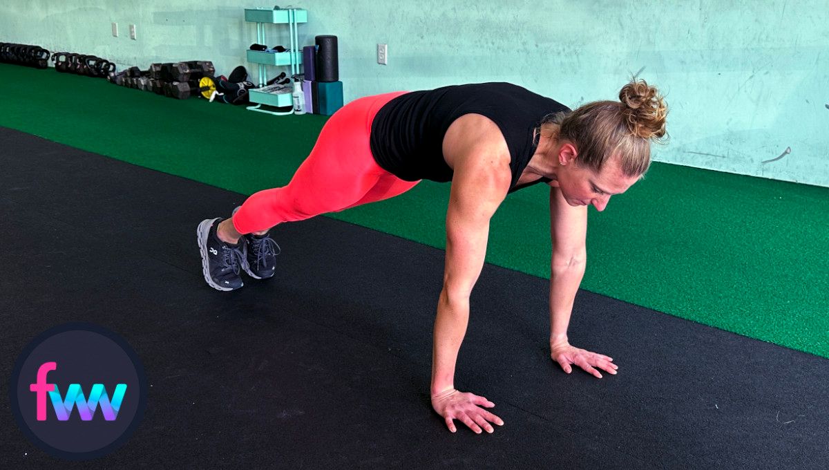 Kindal jumps back to the top of a pushup plank position ready for a solid burpee pushup.