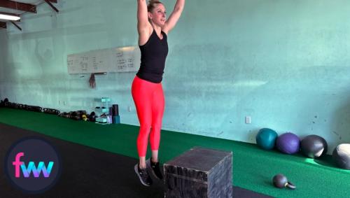 Kindal jumping up out of the box burpee to complete the rep before she fall right back down into the next rep.