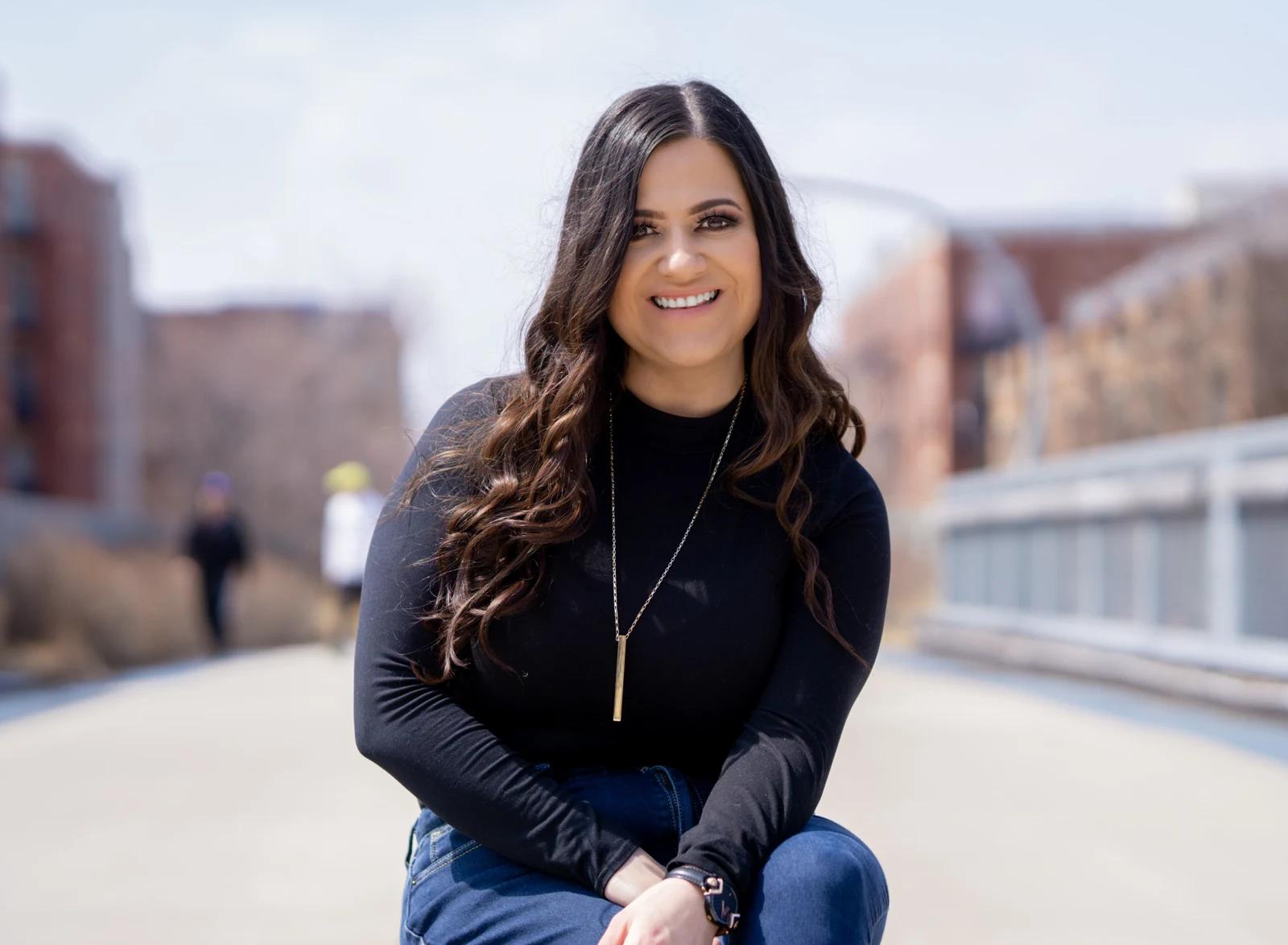 Maria Gutierrez seated outdoors
