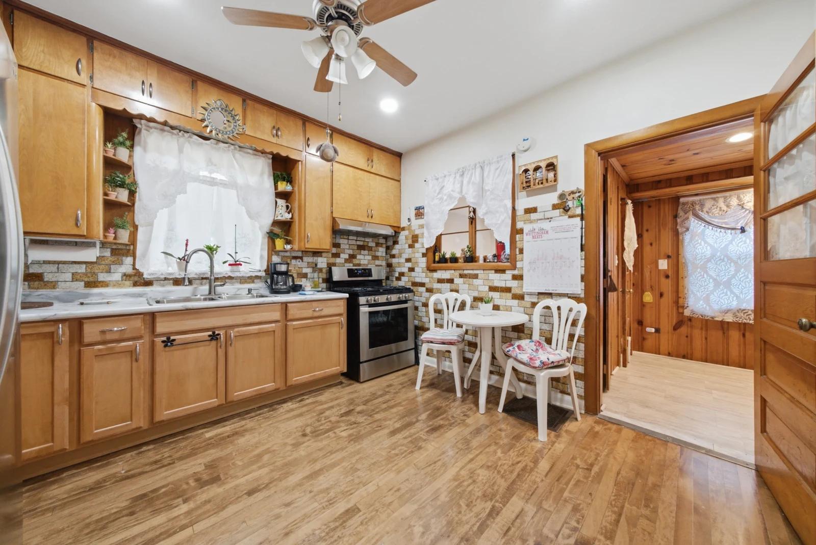 Kitchen with wood cabinets and tiled backsplash