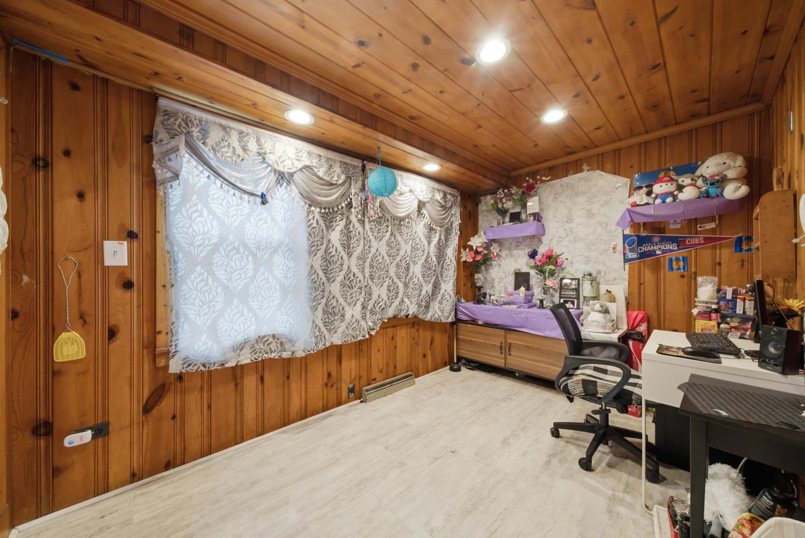 Wood-paneled enclosed porch
