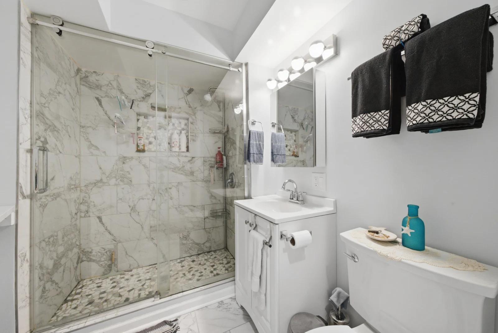 Bathroom with tiled shower