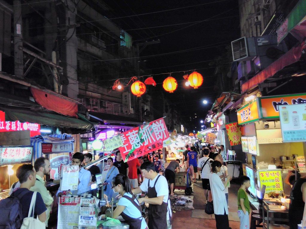 Traveling Taiwan Without Reading Chinese (2026): Night Markets, Bento Counters, Ticket Gates and the Receipt Lottery - English carries you through Taiwan’s airports, metros and highway signs, then disappears at the handwritten stall sign in front of you — here is what those signs, buffet counters, ticket gates and receipts actually say.