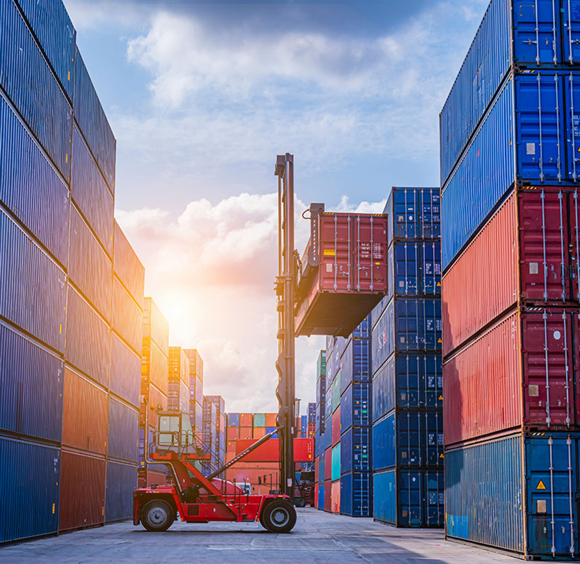 Forklift moving a container