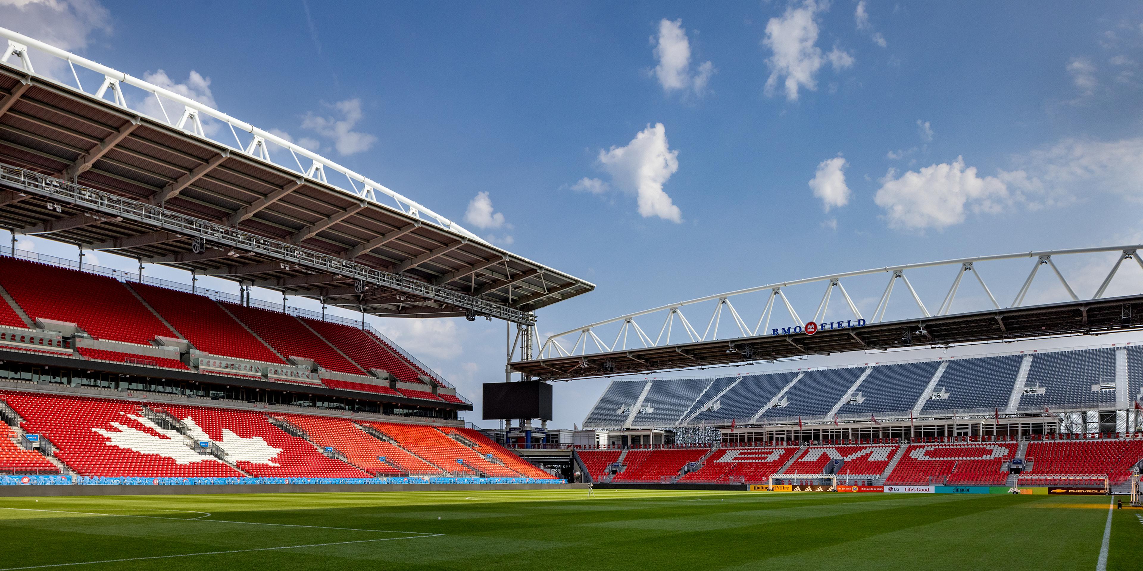 A large stadium with a field and a field.