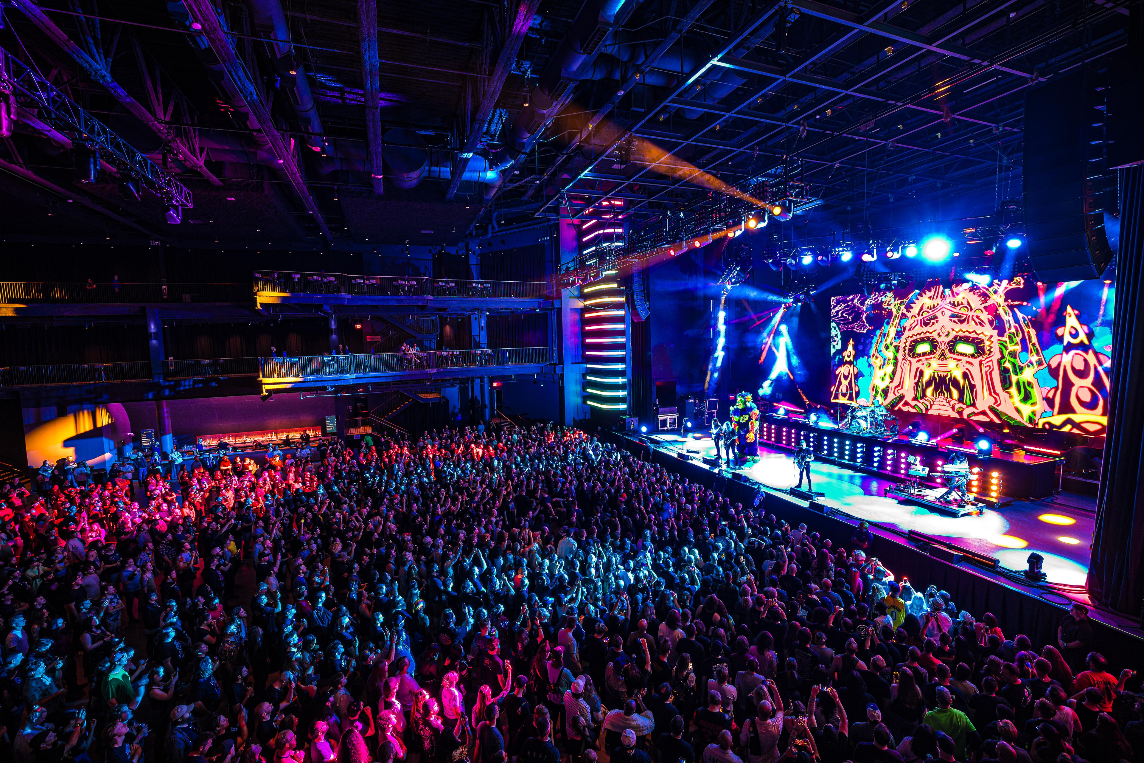 A large crowd of people in a concert.