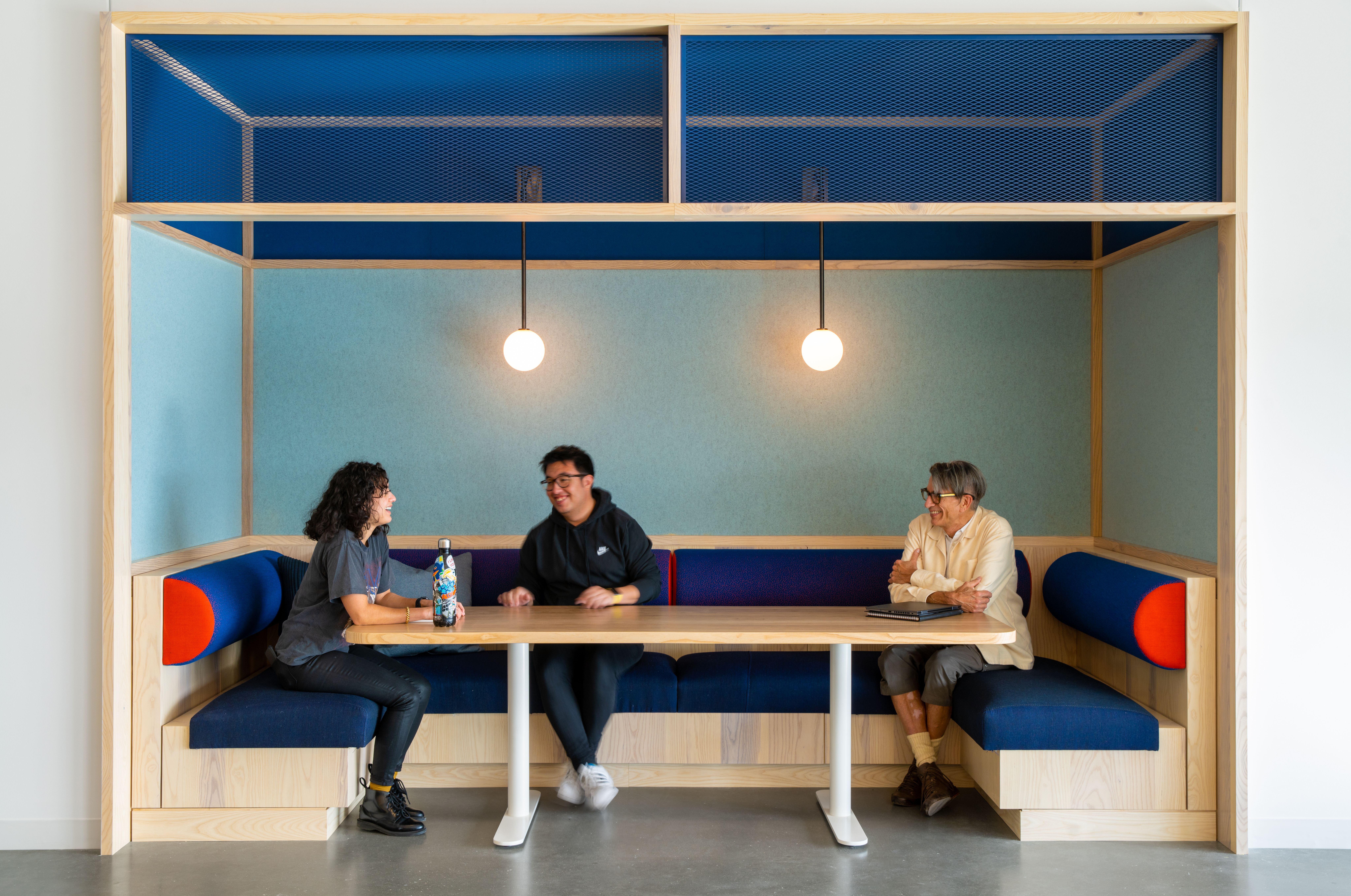 A group of people sitting at a table.