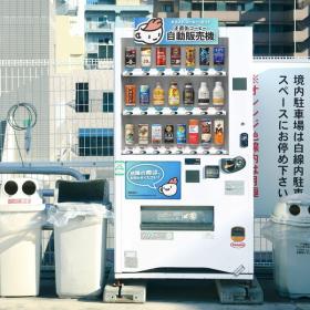 A vending machine with the honest coffee guide logo on it, containing all the canned coffees we reviewed.