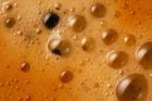 An extreme close up of crema, made up of micro-bubbles of varying sizes.