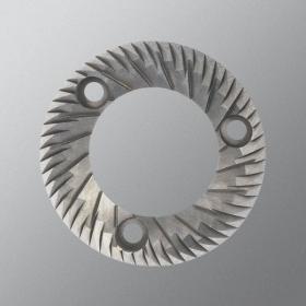 A stainless steel flat burr on a grey background