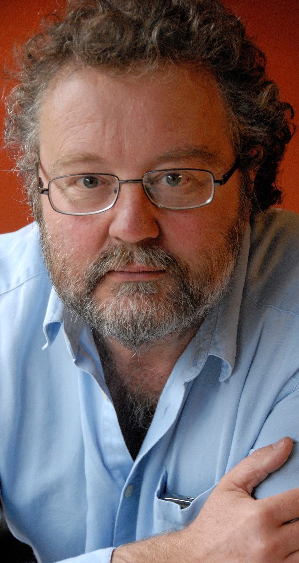 Headshot of John Carlin
