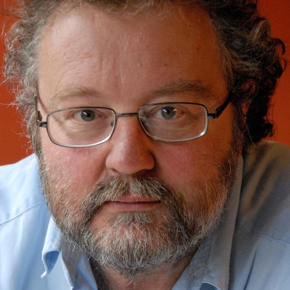 Headshot of John Carlin