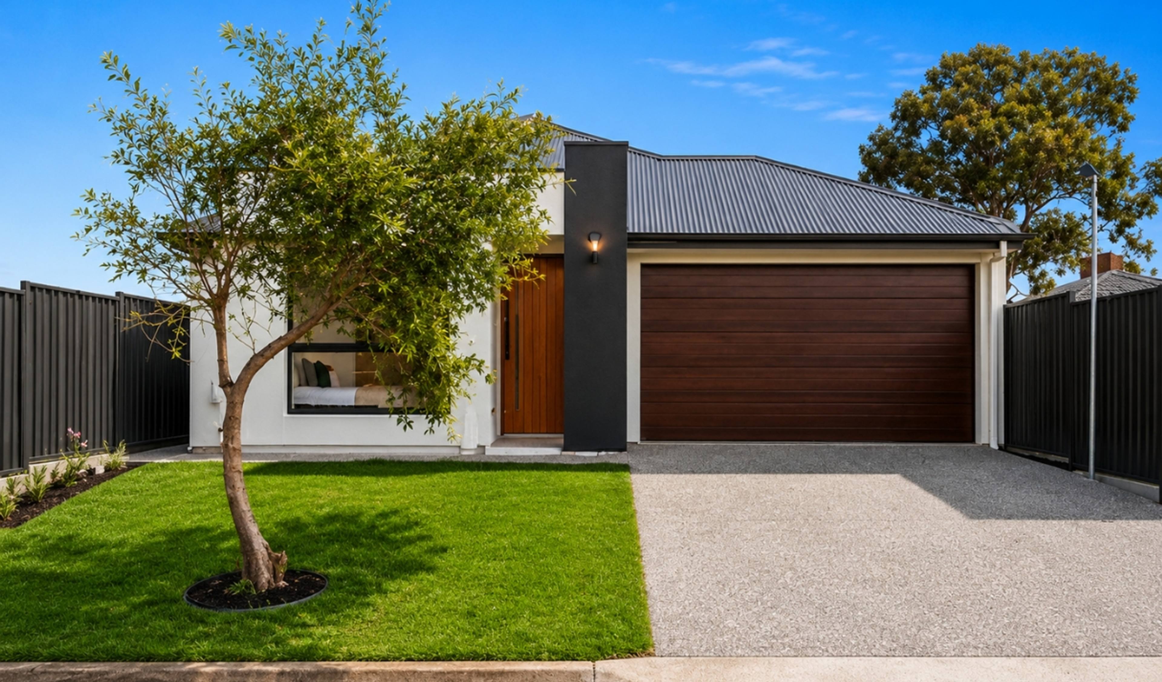 Modern single-storey home with a contemporary façade and double garage.