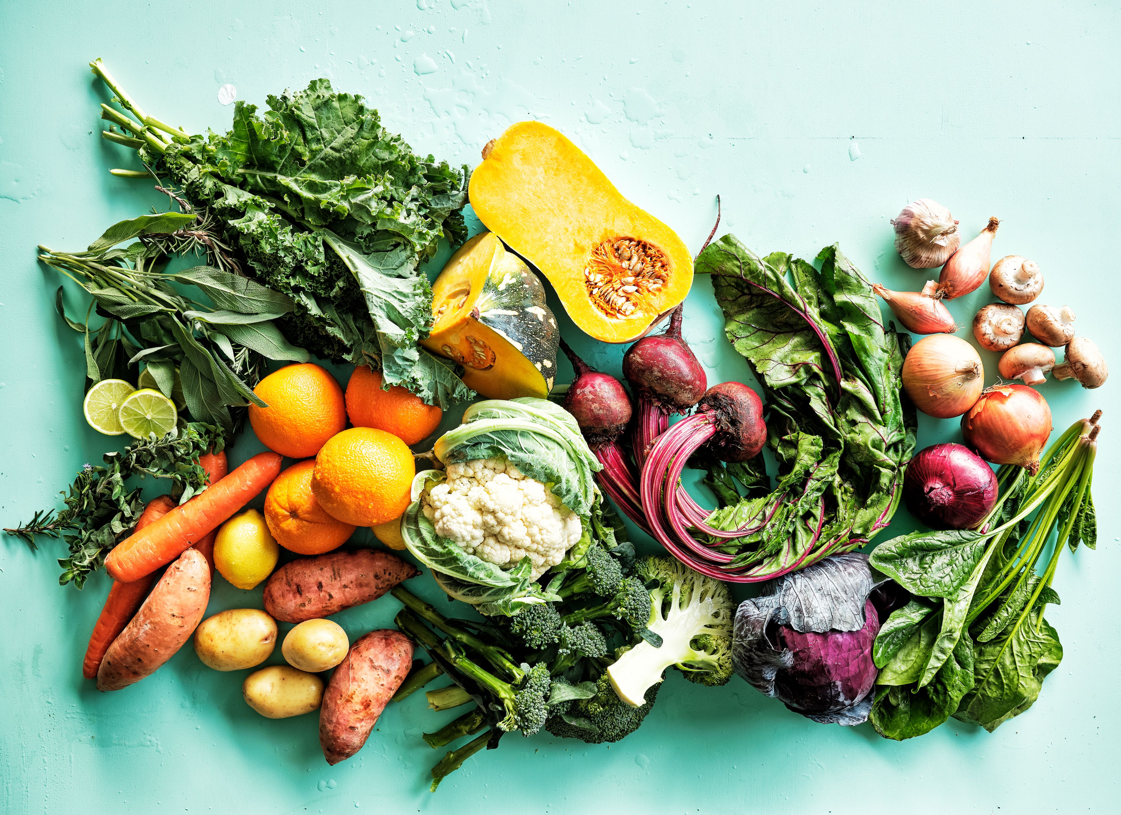 fresh quitelike produce on mint coloured background