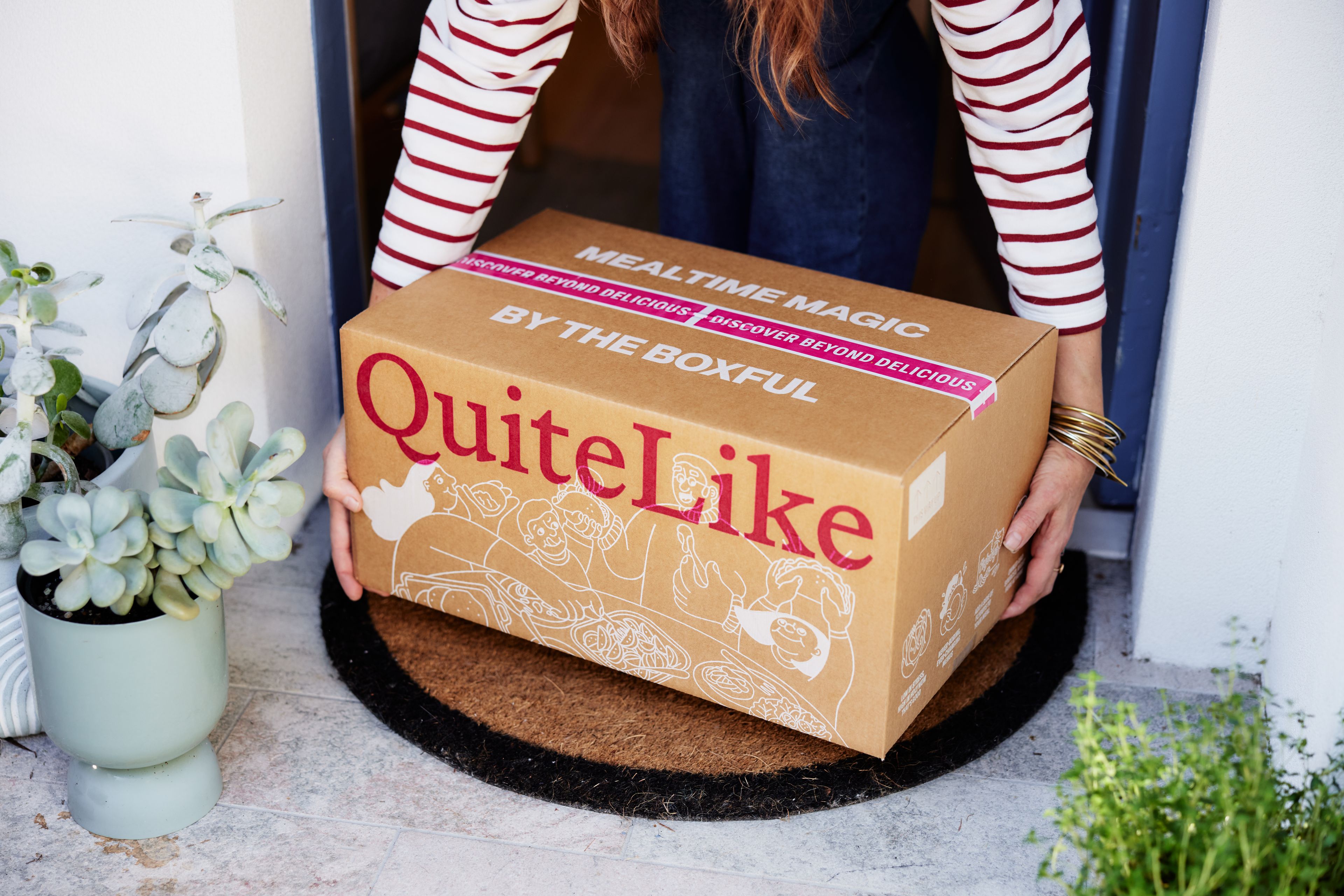 Woman picking up box