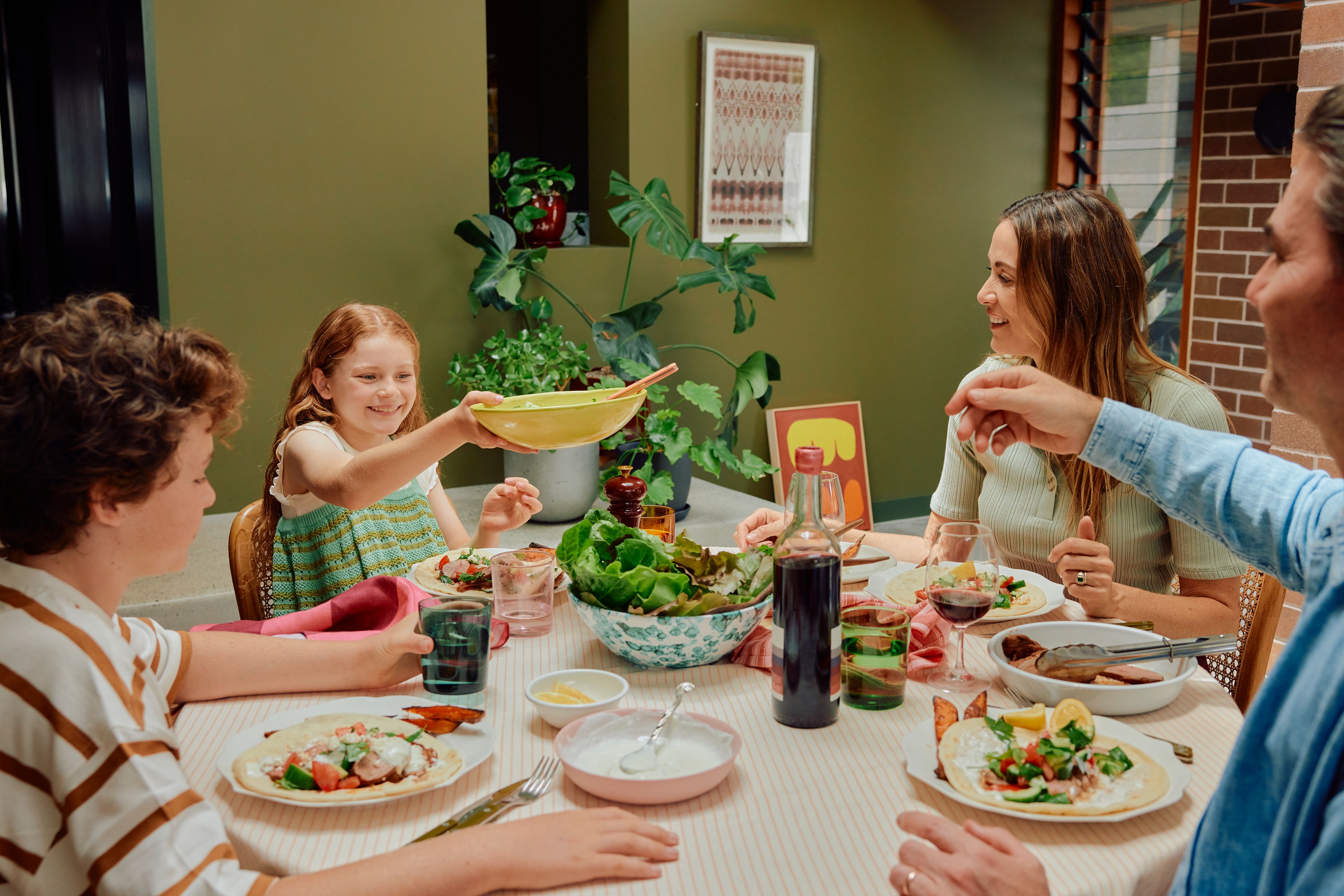 Family enjoying a meal at the table