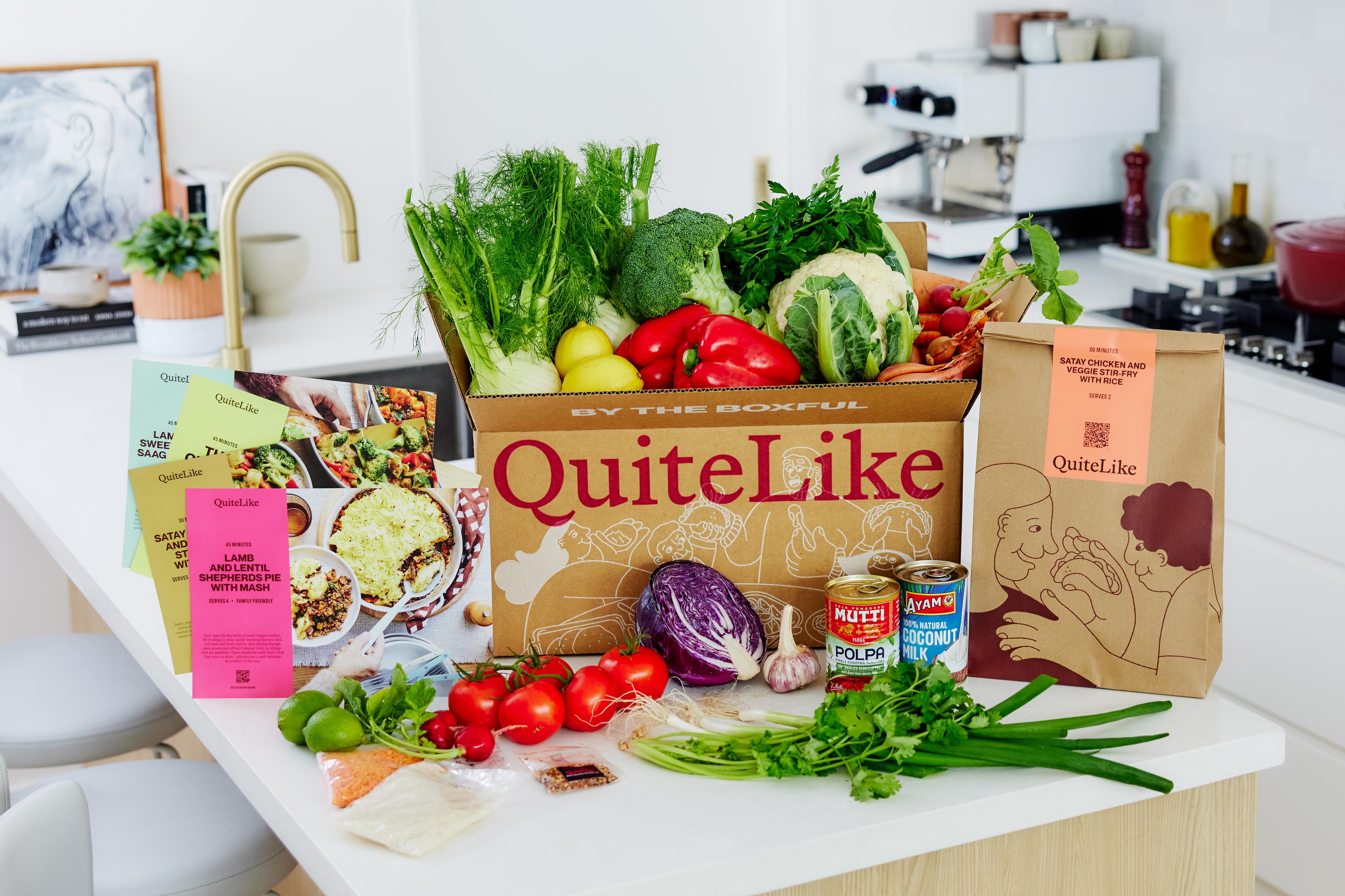 Box on counter with ingredients, meal bags and recipe cards